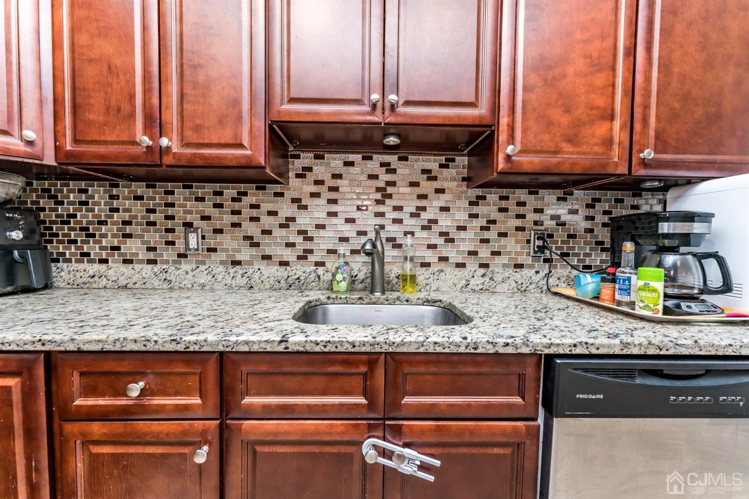27 Fairfax Road Edison, NJ 08817 - Photo 9 of 25 a kitchen with granite countertop cabinets and window