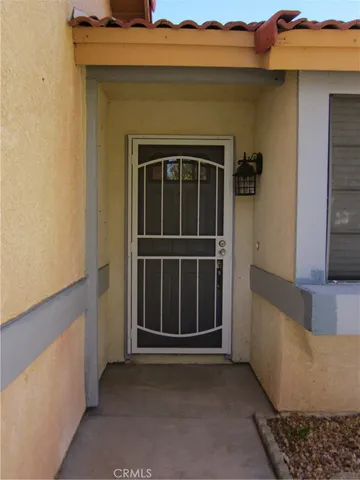 a view of a door and a window