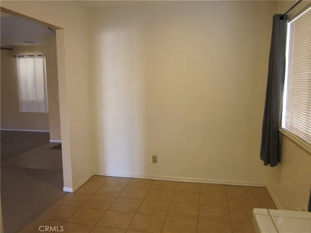 a view of an empty room with a fireplace