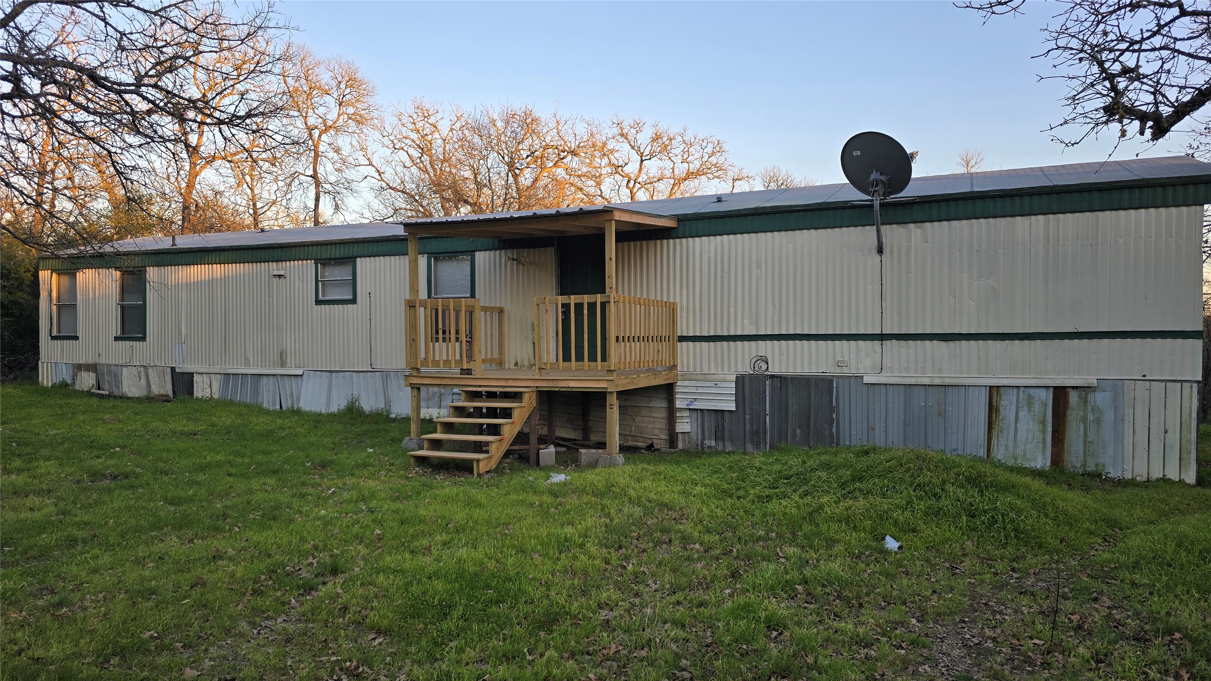 8315 Burleson Manor Road, Unit B Manor, TX 78653 - Photo 2 of 15 Rear view of house with a yard and a deck