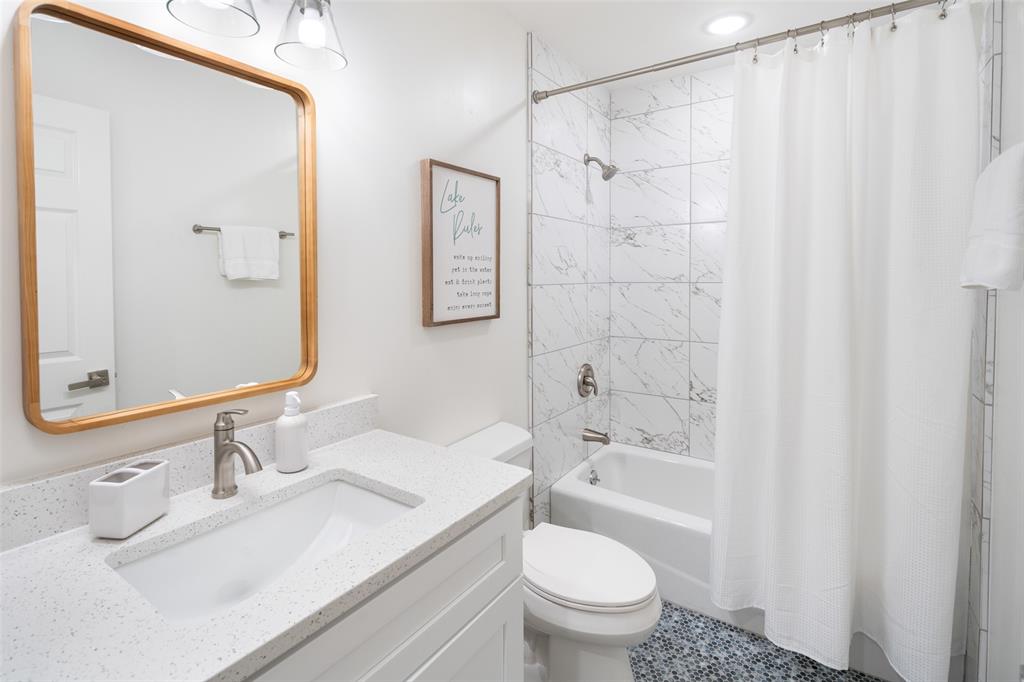 1907 Buck Run Graford, TX 76449 - Photo 20 of 33 a bathroom with a sink toilet and shower