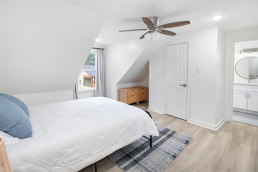 1907 Buck Run Graford, TX 76449 - Photo 21 of 33 a bedroom with a bed and a ceiling fan