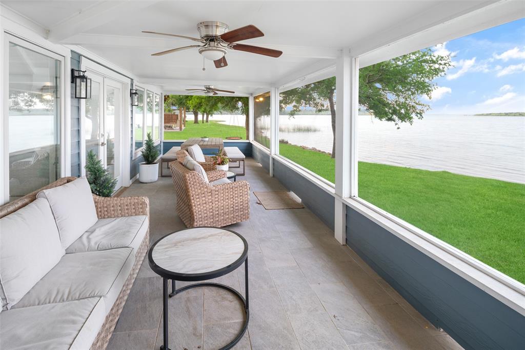 1907 Buck Run Graford, TX 76449 - Photo 25 of 33 a living room with patio furniture and a large window
