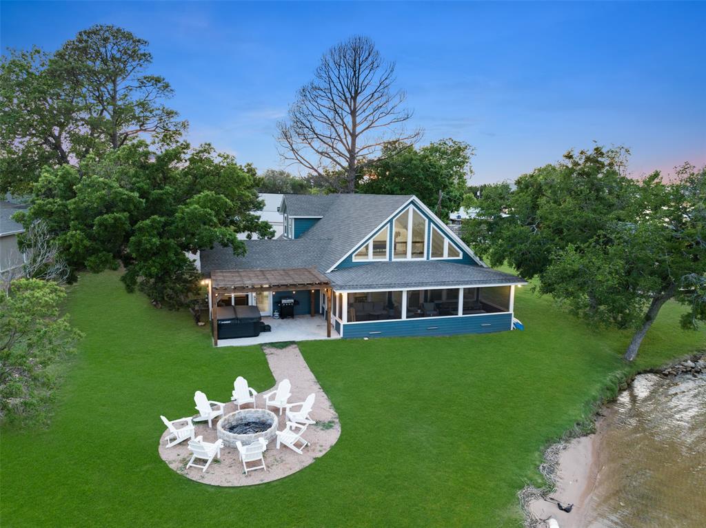 1907 Buck Run Graford, TX 76449 - Photo 30 of 33 a front view of a house with a yard table and chairs