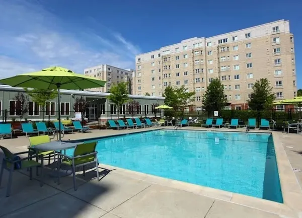 a view of pool with outdoor seating
