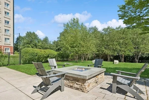 a table and chairs sitting in the garden