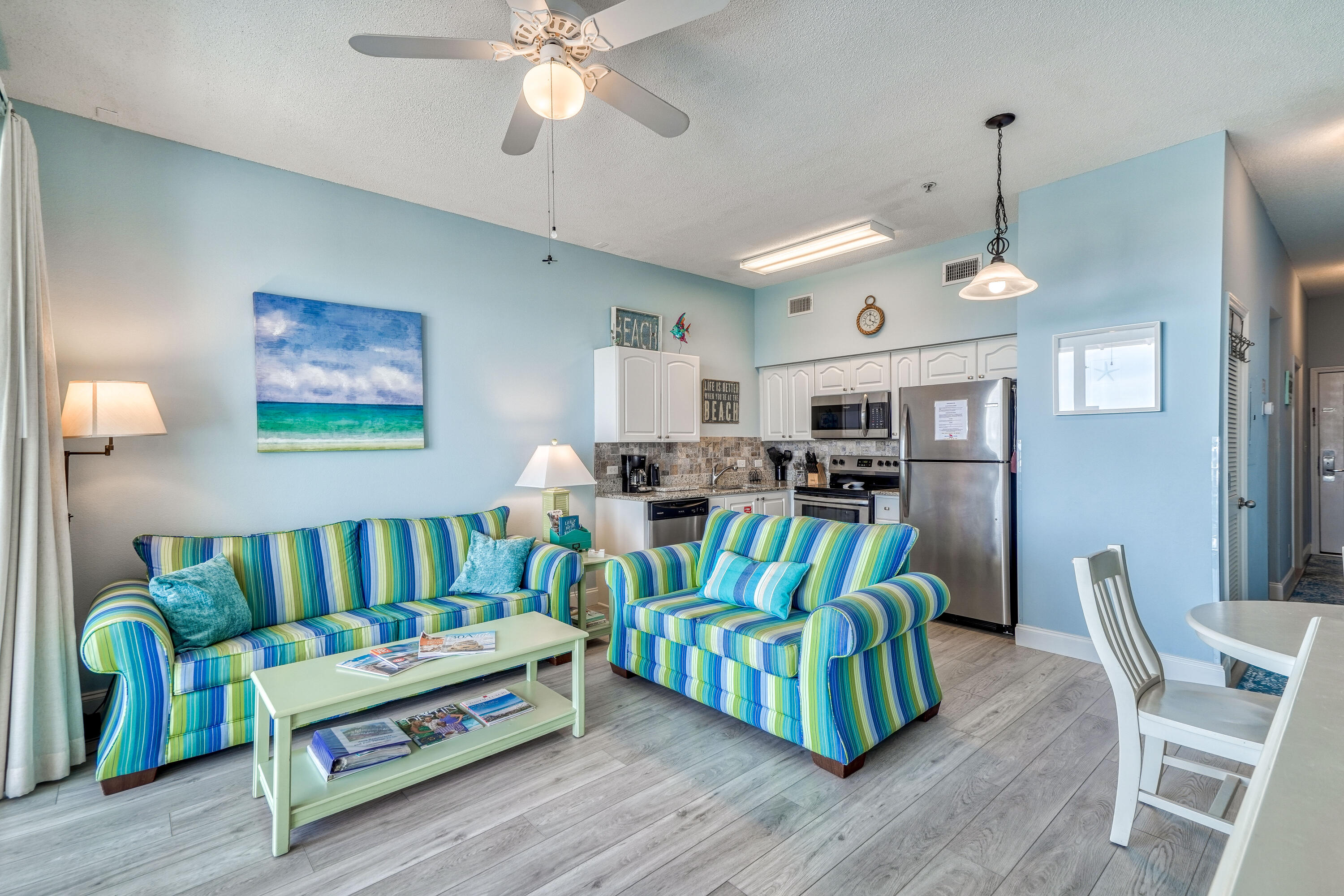 145 Spires Lane, Unit 406 Santa Rosa Beach, FL 32459 - Photo 6 of 38 a living room with furniture and wooden floor