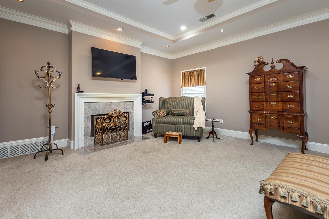 9530 Mayfield Road South Collierville, TN 38017 - Photo 14 of 25 Primary Bedroom includes sitting area and fireplace.