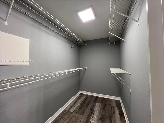 a view of a room with racks on the wall