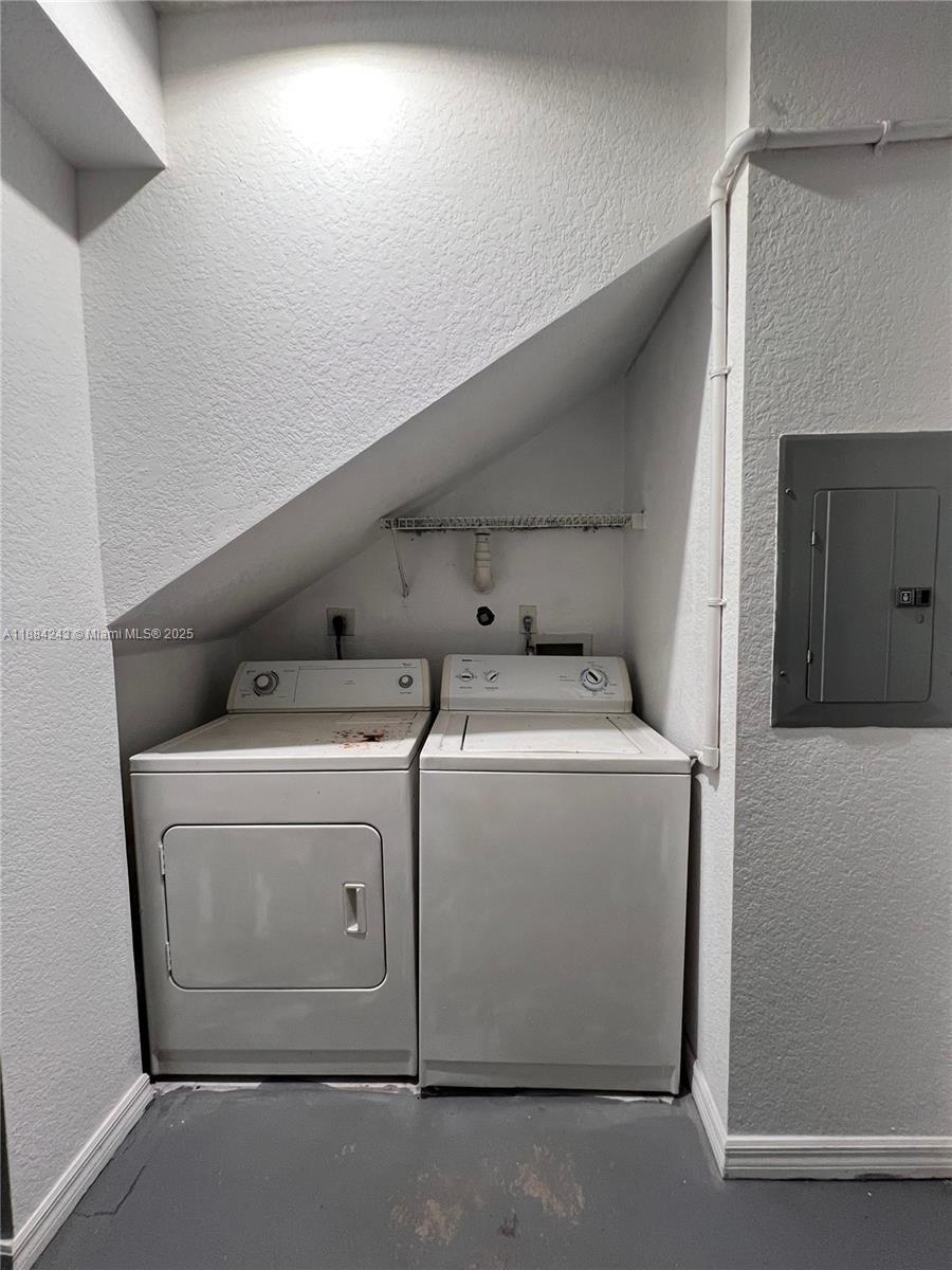 2400 Centergate Drive, Unit 102 Miramar, FL 33025 - Photo 12 of 12 a utility room with dryer and washer