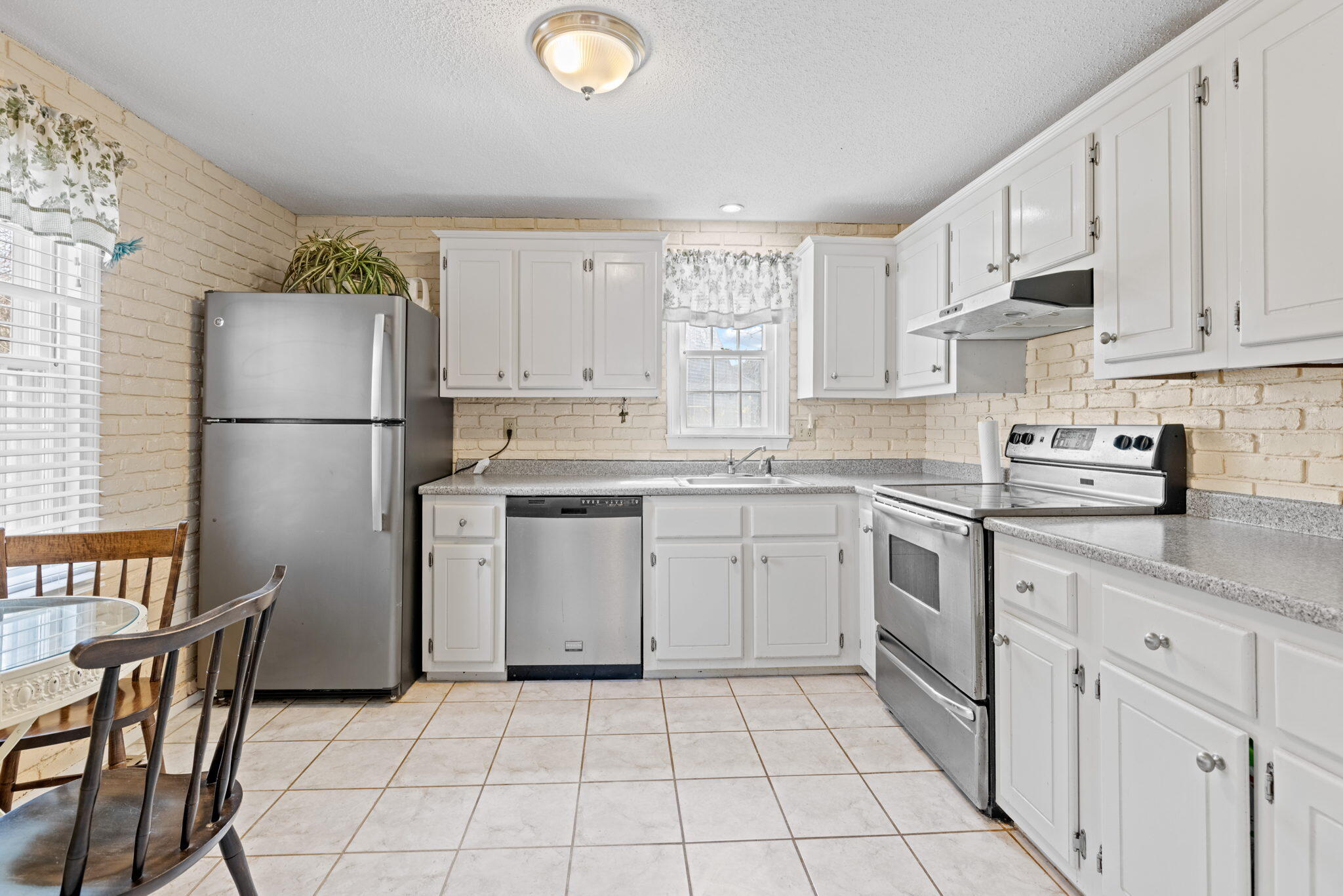 292 Megan Road Hyannis, MA 02601 - Photo 6 of 14 a kitchen with a stove a sink and a refrigerator