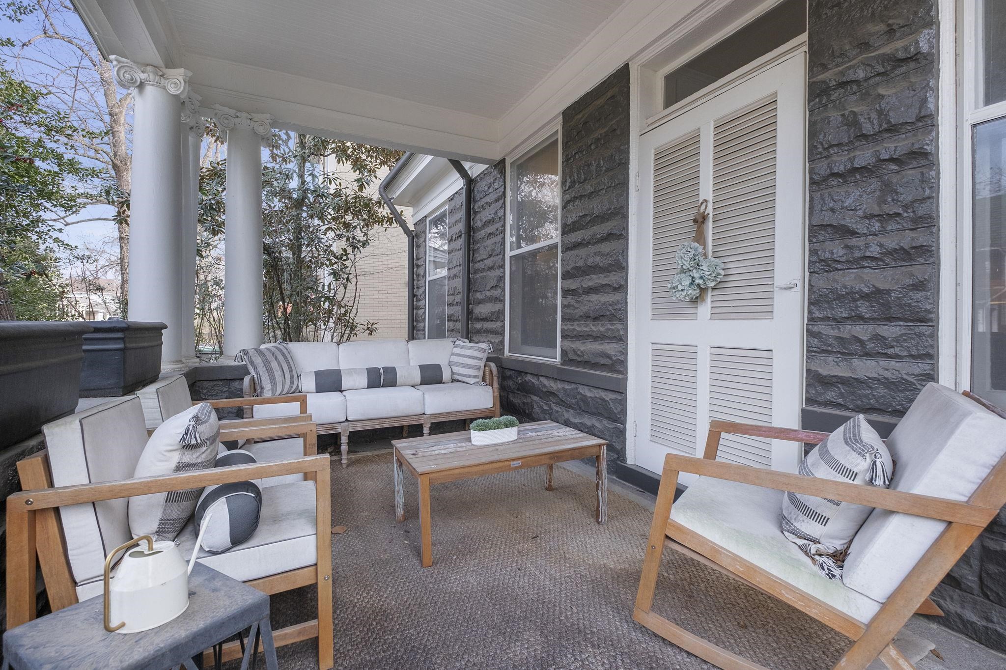 1273 Carr Avenue Memphis, TN 38104 - Photo 1 of 39 Inviting covered front porch perfect for relaxing or entertaining.