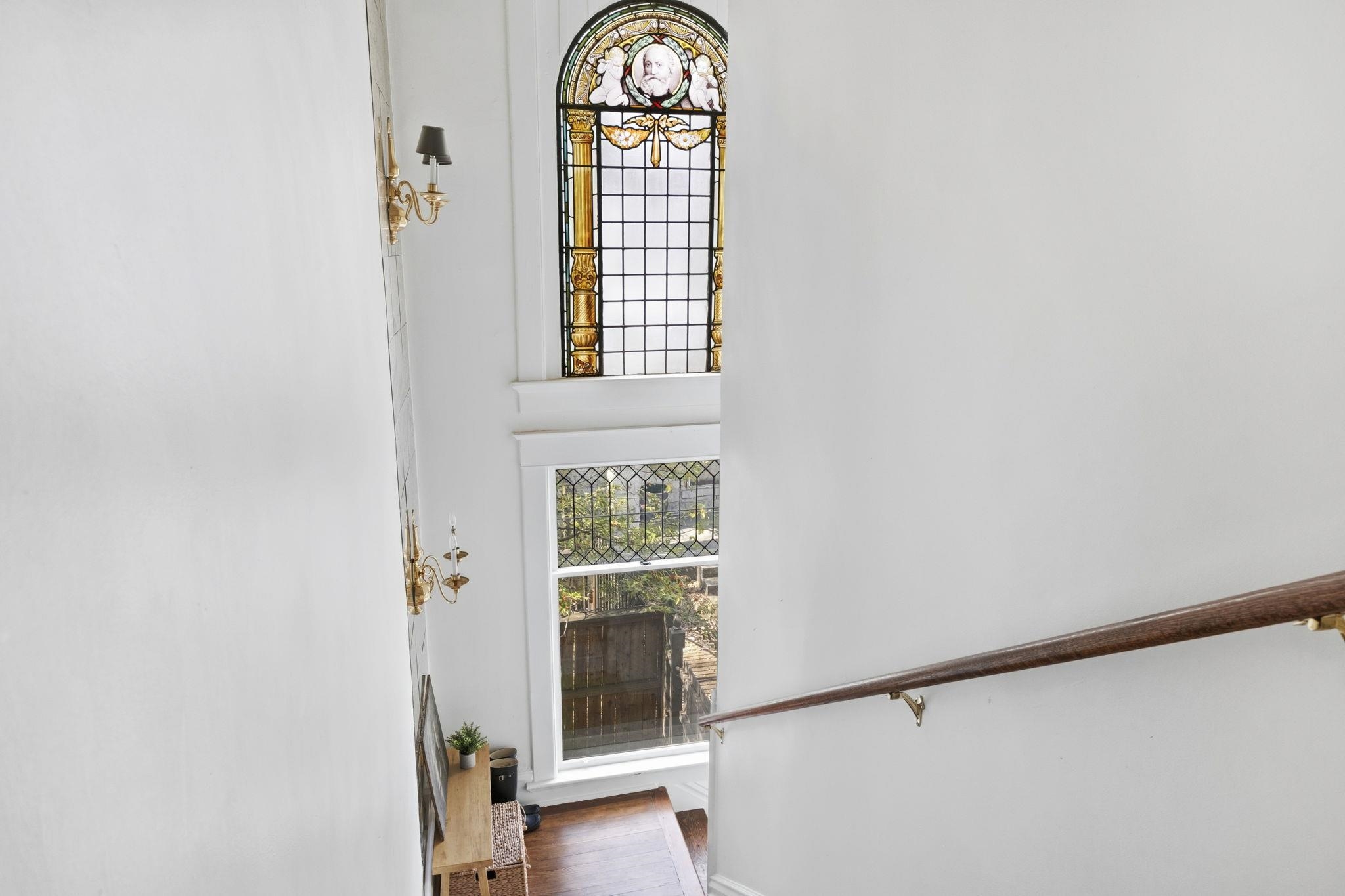 1273 Carr Avenue Memphis, TN 38104 - Photo 18 of 39 Beautiful stained-glass window at the staircase landing adds timeless character and historic charm.