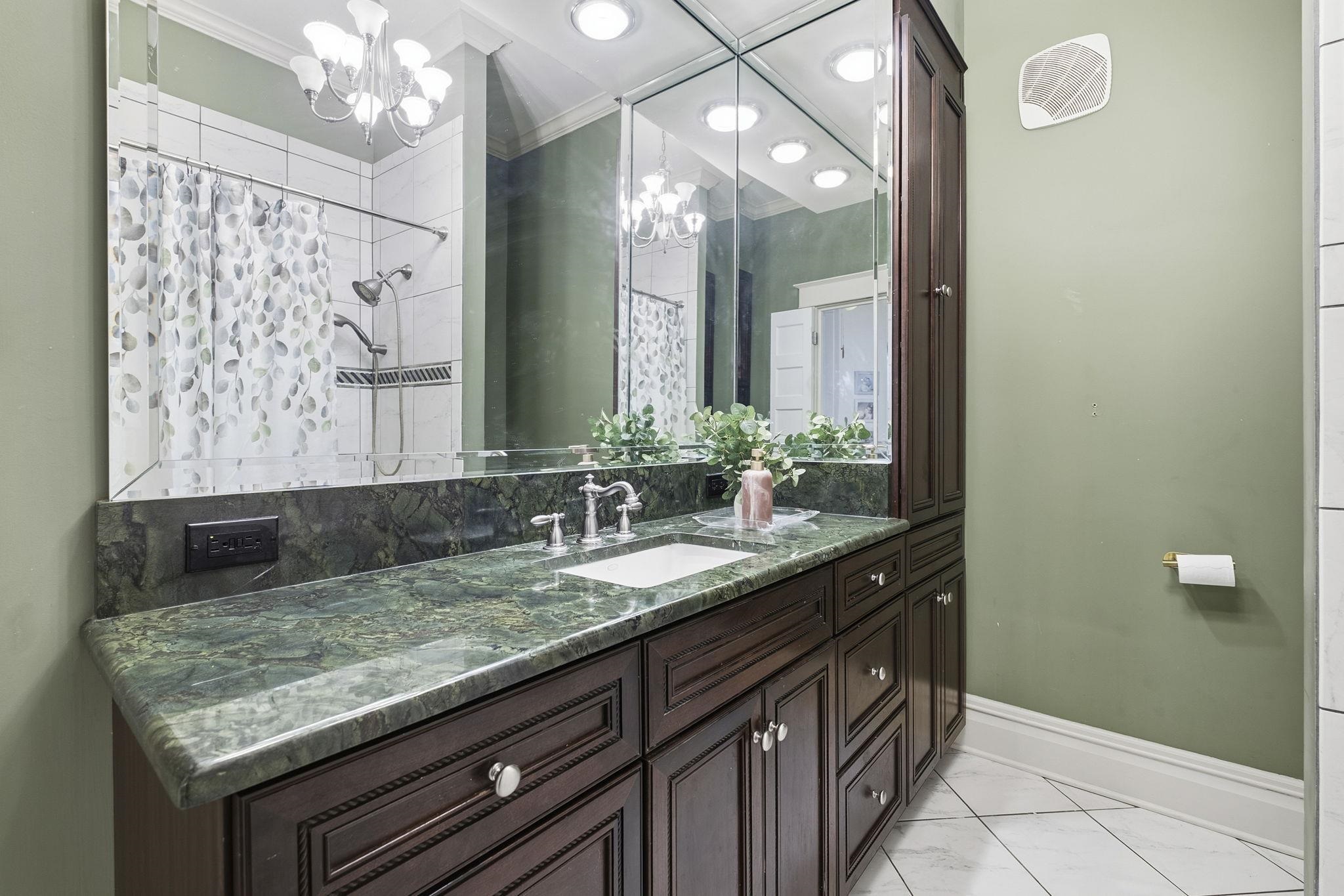 1273 Carr Avenue Memphis, TN 38104 - Photo 22 of 39 Primary bathroom with double vanity offering generous counter space and storage.