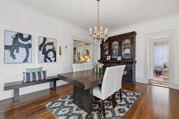 a view of a living room and a floor to ceiling window or dining room