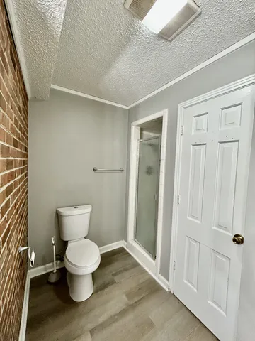 a white toilet sitting next to a bathroom sink