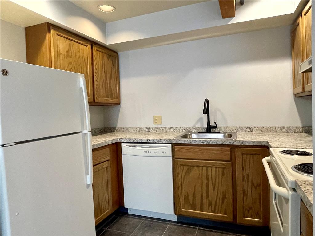 101 Race Street, Unit 205 Catasauqua, PA 18032 - Photo 4 of 19 Functional kitchen with ample cabinet space and modern appliances for everyday living.
