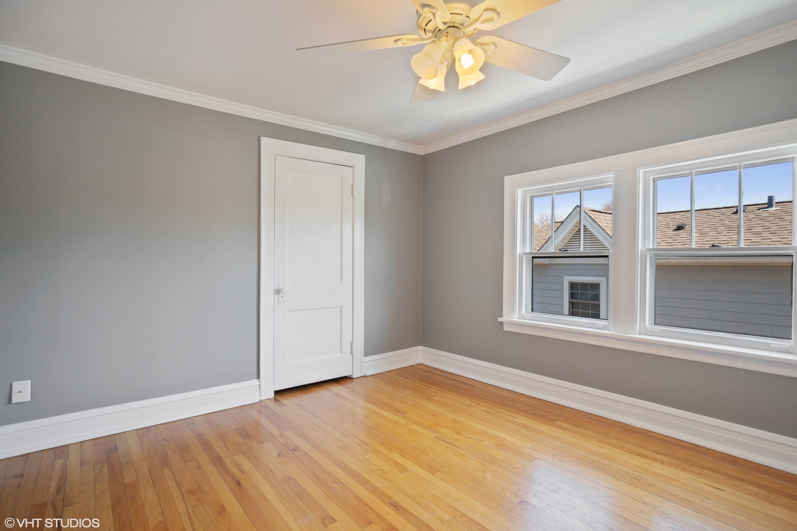 822 East Thacker Street Des Plaines, IL 60016 - Photo 16 of 20 a view of an empty room with a window and wooden floor