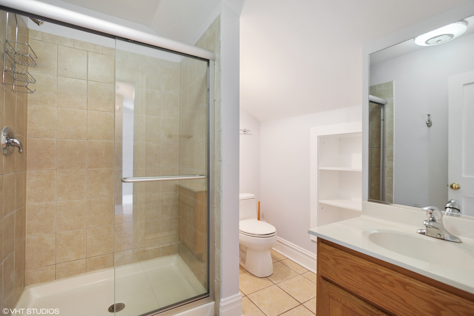 822 East Thacker Street Des Plaines, IL 60016 - Photo 17 of 20 a bathroom with a shower a sink and a toilet