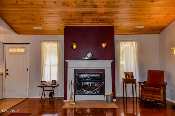 a view of a livingroom with furniture and window