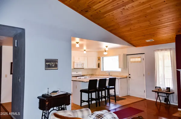 a livingroom with furniture and wooden floor