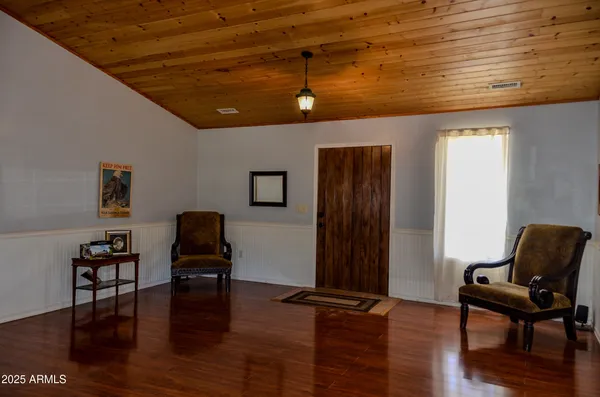 a living room with furniture a fireplace and a table