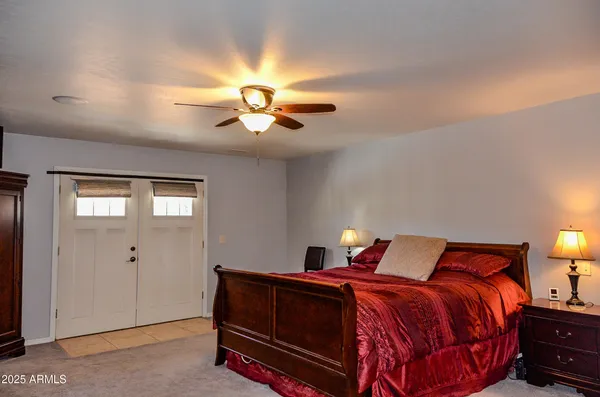 a bedroom with a bed and window