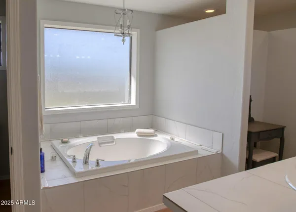 a view of outdoor space with wooden floor and windows