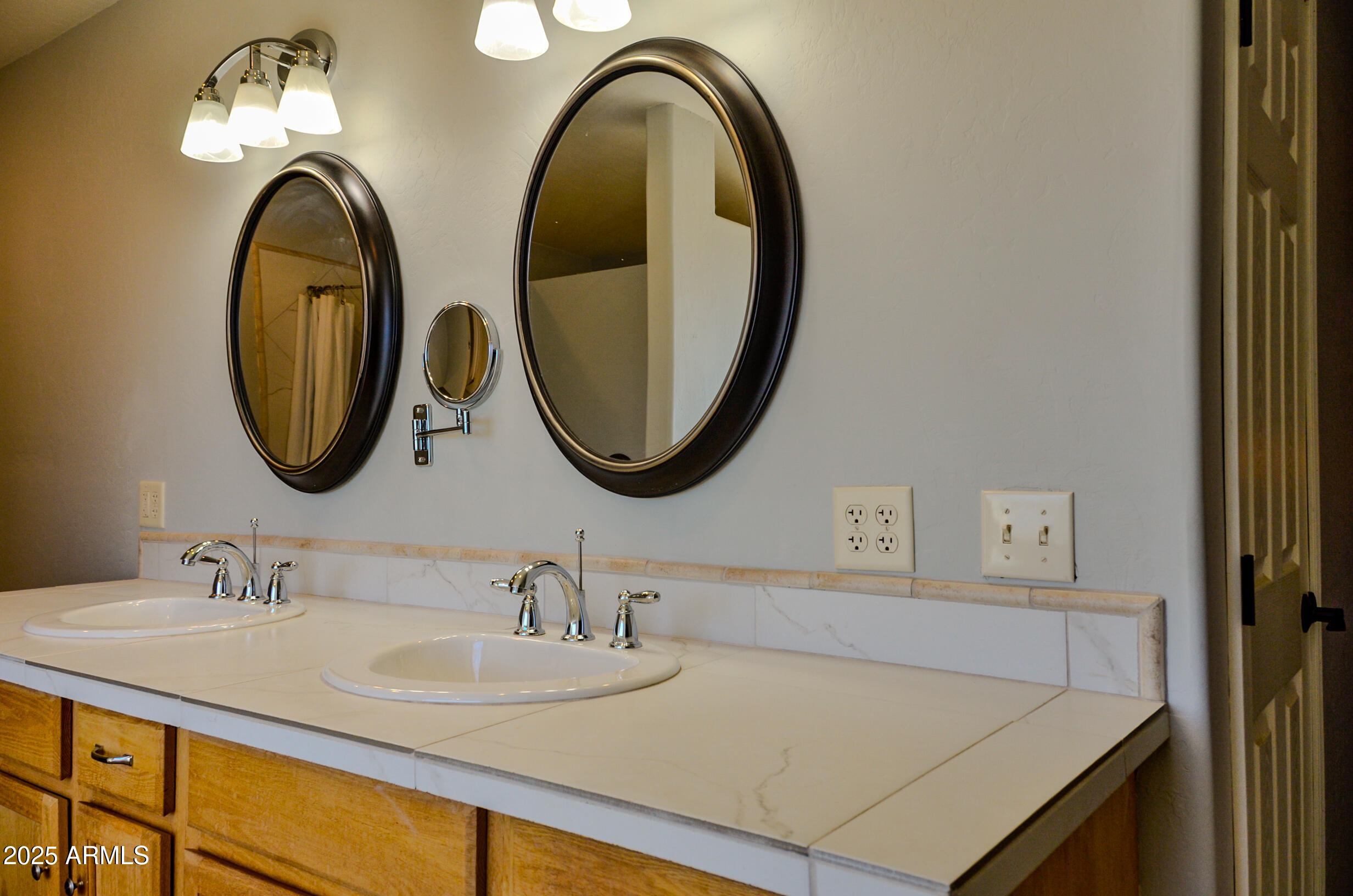 685 Kuhn Road Pinedale, AZ 85934 - Photo 40 of 74 a bathroom with a granite countertop double vanity sinks and a mirror