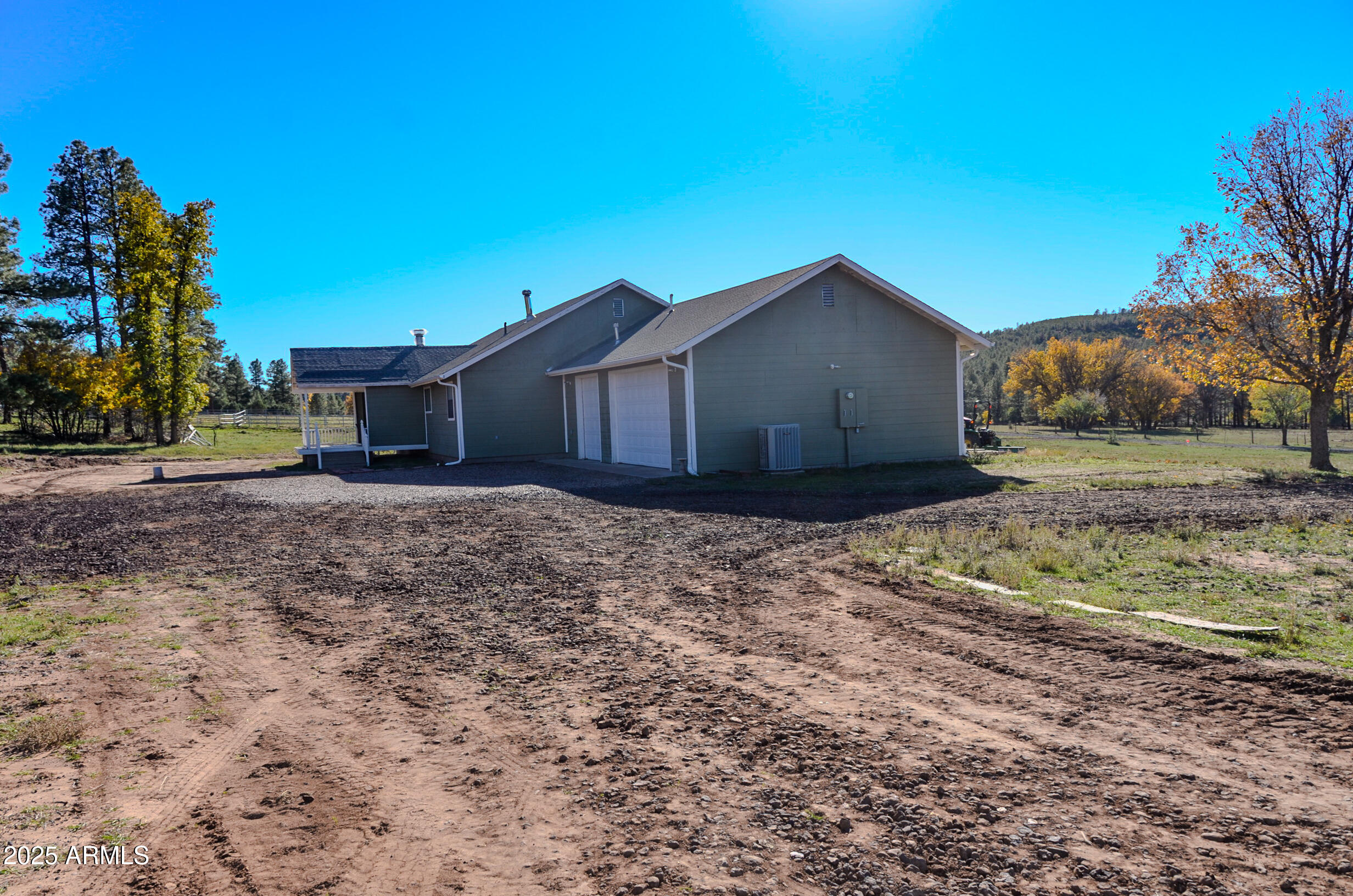 685 Kuhn Road Pinedale, AZ 85934 - Photo 69 of 74 a wooden house with a large tree in front of it