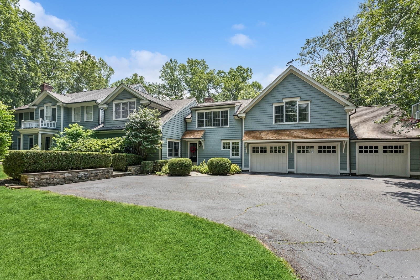 47 Tubbs Spring Drive Weston, CT 06883 - Photo 1 of 1 a view of a house with a yard and potted plants