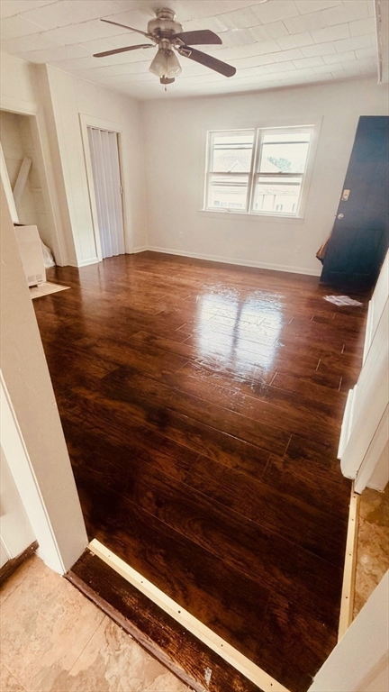 245 County Street, Unit 10 Fall River, MA 02723 - Photo 4 of 9 a view of empty room with wooden floor and fan
