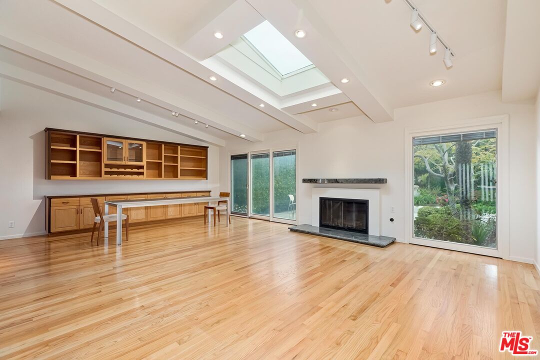 18409 Wakecrest Drive Malibu, CA 90265 - Photo 12 of 32 a view of dining room with furniture and fireplace