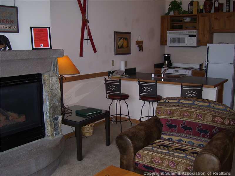 195 River Run Road, Unit 8074 Keystone, CO 80435 - Photo 3 of 21 a living room with furniture and a fireplace