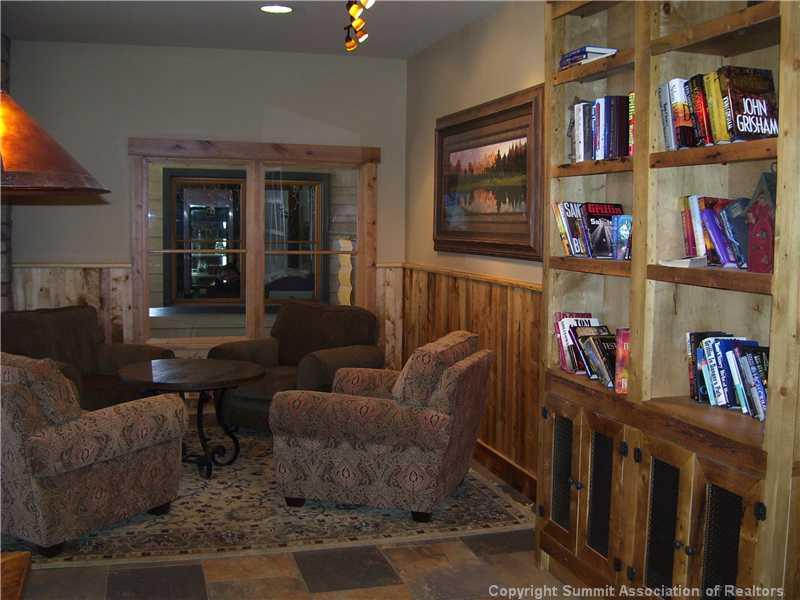 195 River Run Road, Unit 8074 Keystone, CO 80435 - Photo 21 of 21 a living room with furniture and a book shelf