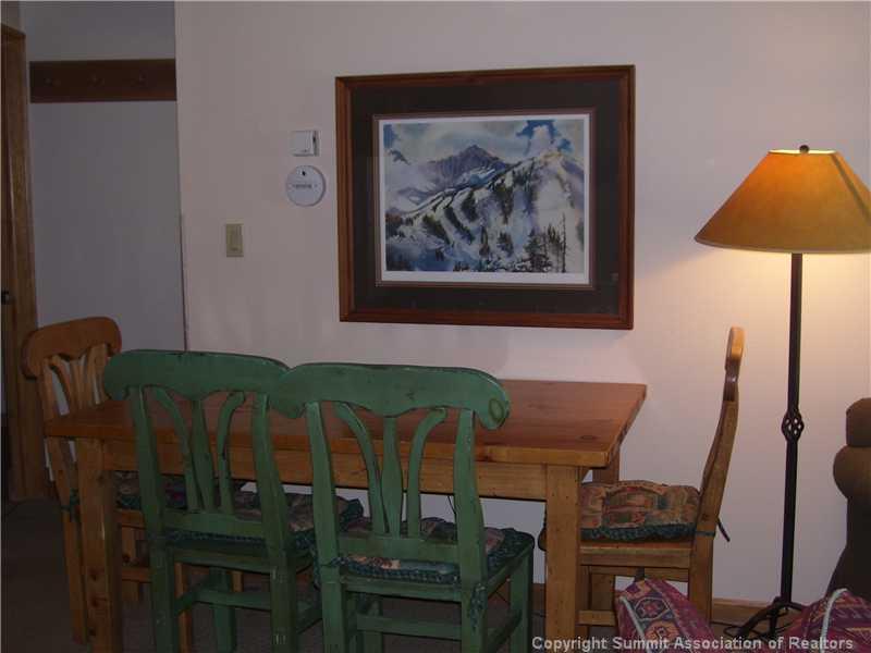 195 River Run Road, Unit 8074 Keystone, CO 80435 - Photo 5 of 21 a view of a dining room with furniture and wooden floor