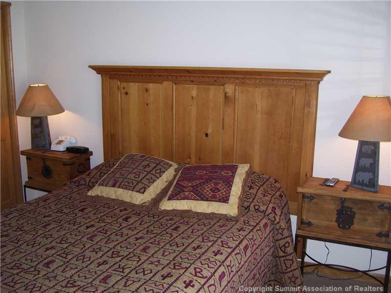 195 River Run Road, Unit 8074 Keystone, CO 80435 - Photo 8 of 21 a bedroom with a bed and a lamp on table