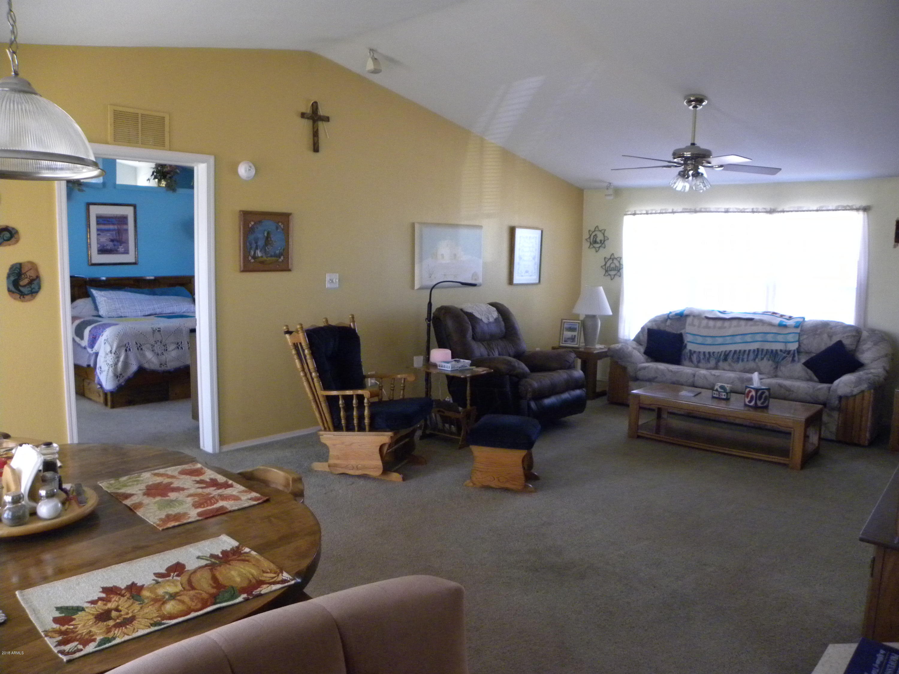 22446 West Peak View Road Wittmann, AZ 85361 - Photo 3 of 21 Dining and great room