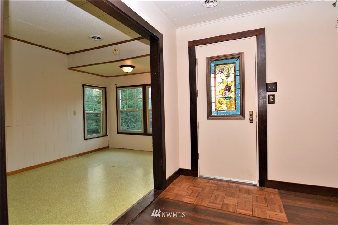 116 Dungan Road Kelso, WA 98626 - Photo 5 of 40 a view of an empty room with wooden floor and a window