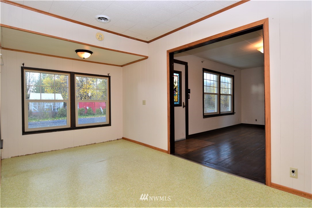 116 Dungan Road Kelso, WA 98626 - Photo 6 of 40 an empty room with wooden floor and windows