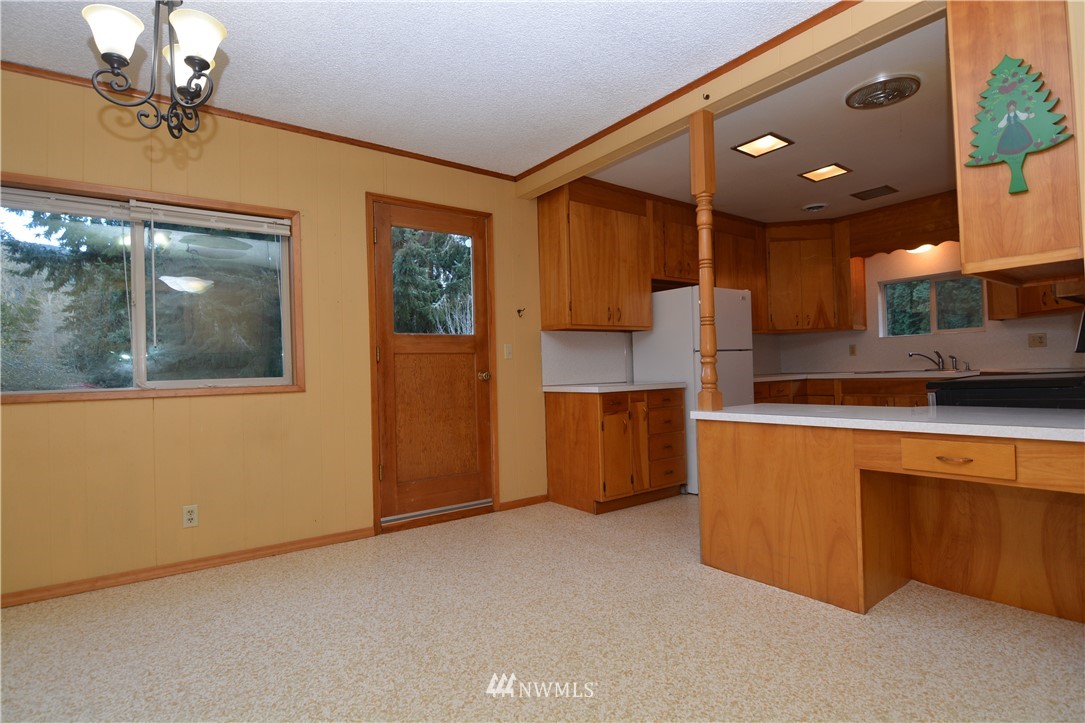 116 Dungan Road Kelso, WA 98626 - Photo 10 of 40 a kitchen with stainless steel appliances granite countertop a sink and a refrigerator