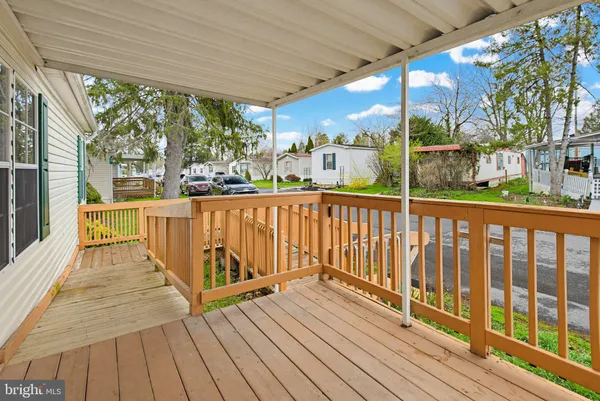 a view of a balcony with wooden floor