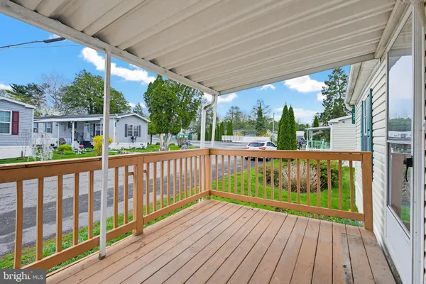 a view of a street with wooden floor