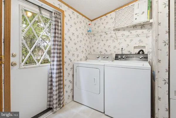a utility room with dryer and washer