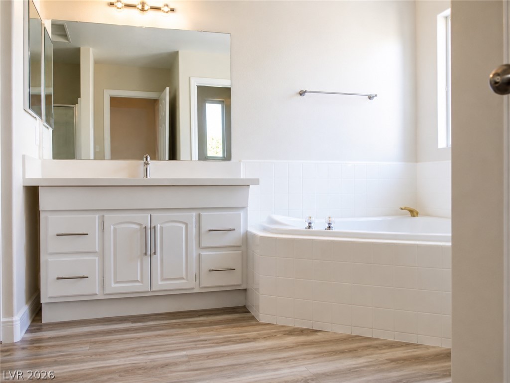 200 East Gamebird Road Pahrump, NV 89048 - Photo 13 of 23 A well-appointed bath features a deep soaking tub and a generous vanity with ample storage.