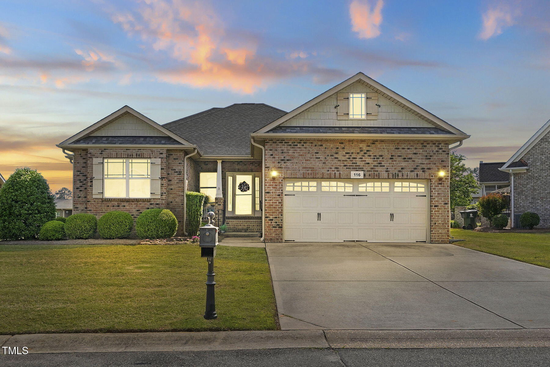 116 Colonade Court Benson, NC 27504 - Photo 1 of 37 a front view of a house with a yard