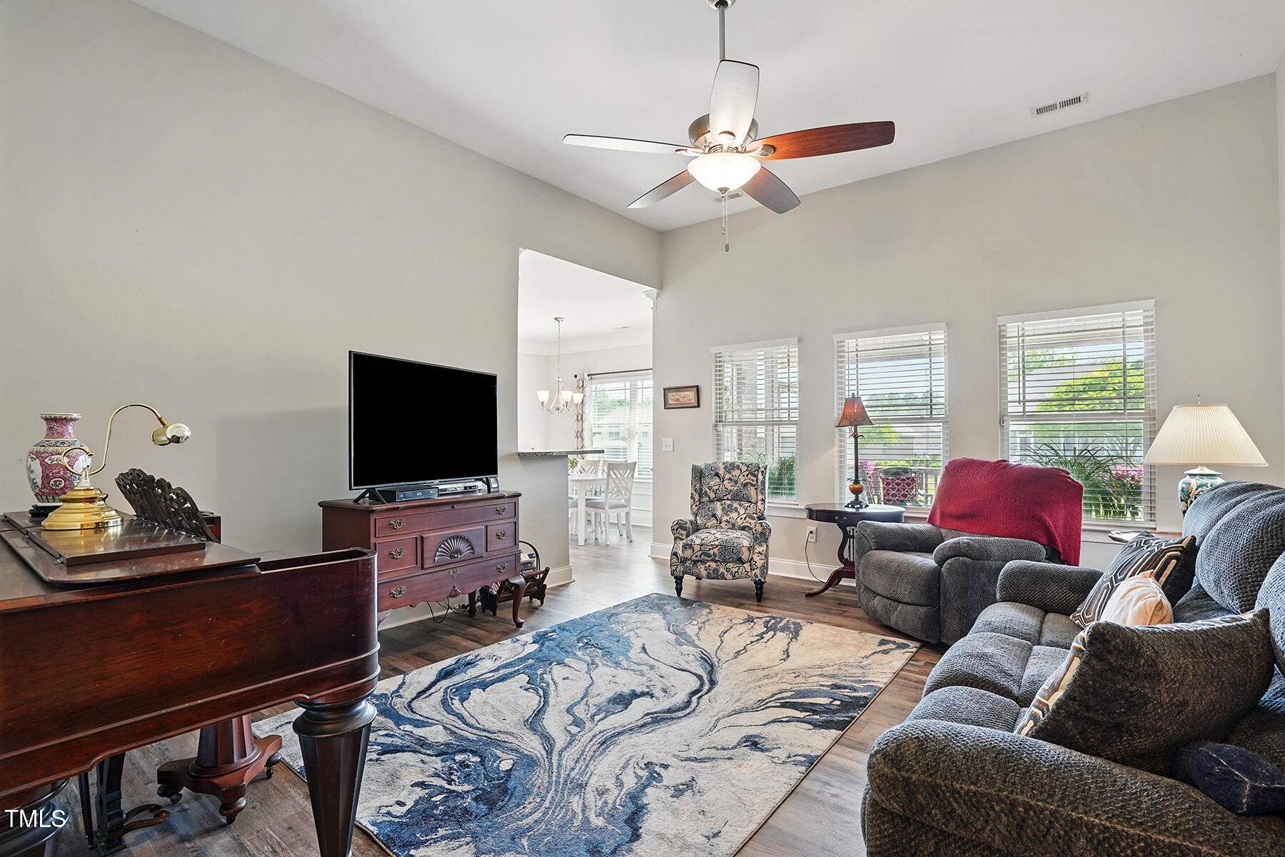 116 Colonade Court Benson, NC 27504 - Photo 11 of 37 a living room with furniture a flat screen tv and a window