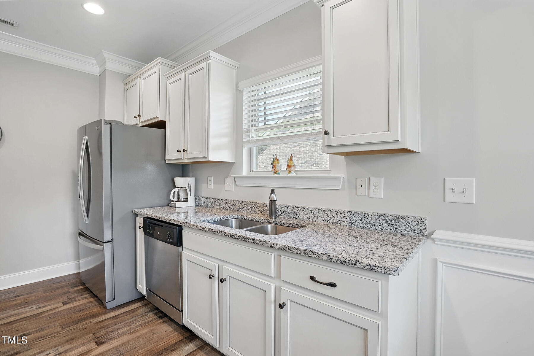 116 Colonade Court Benson, NC 27504 - Photo 15 of 37 a kitchen with stainless steel appliances granite countertop a sink stove and refrigerator