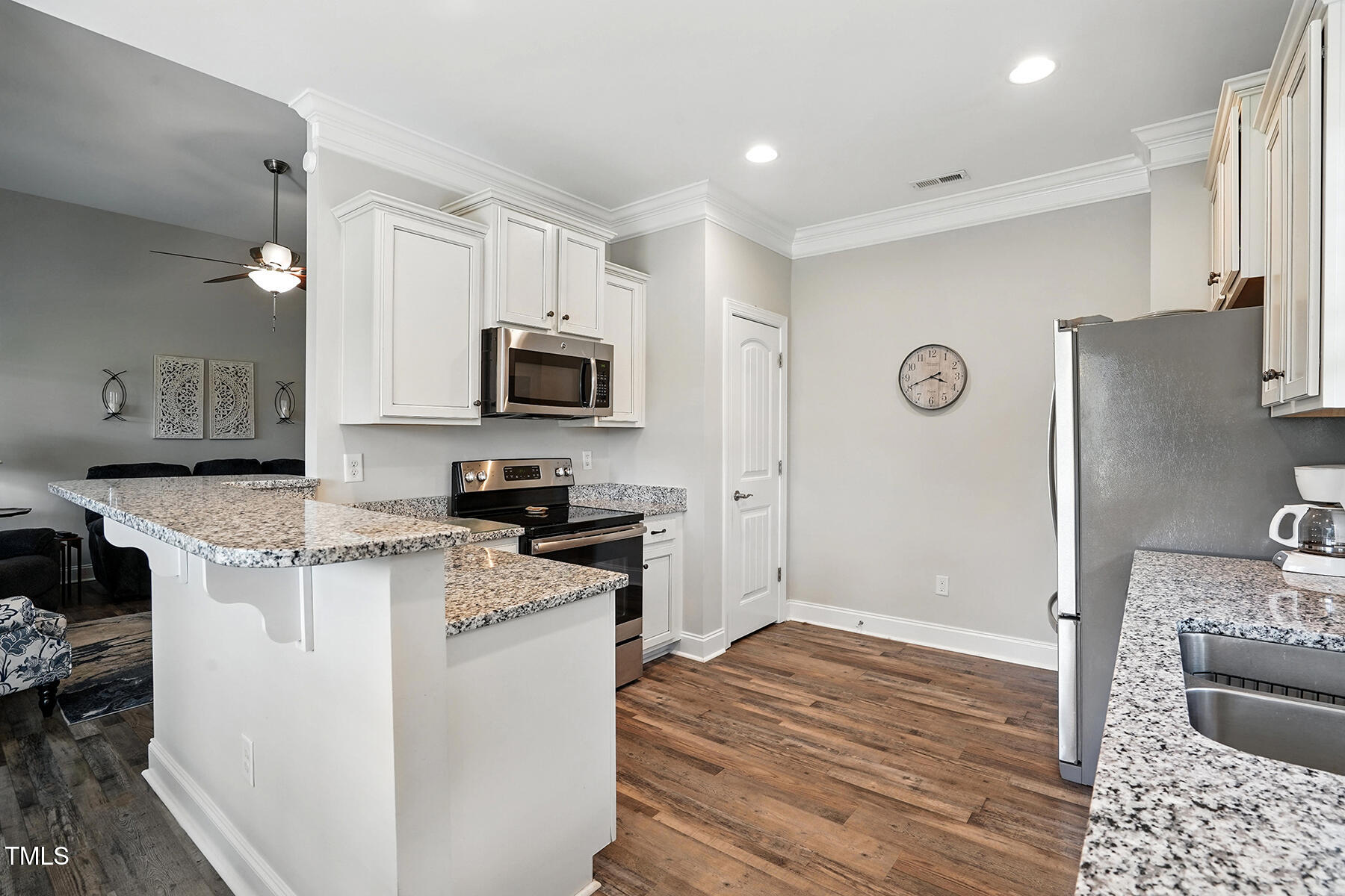 116 Colonade Court Benson, NC 27504 - Photo 16 of 37 a kitchen with stainless steel appliances granite countertop a refrigerator stove microwave and sink