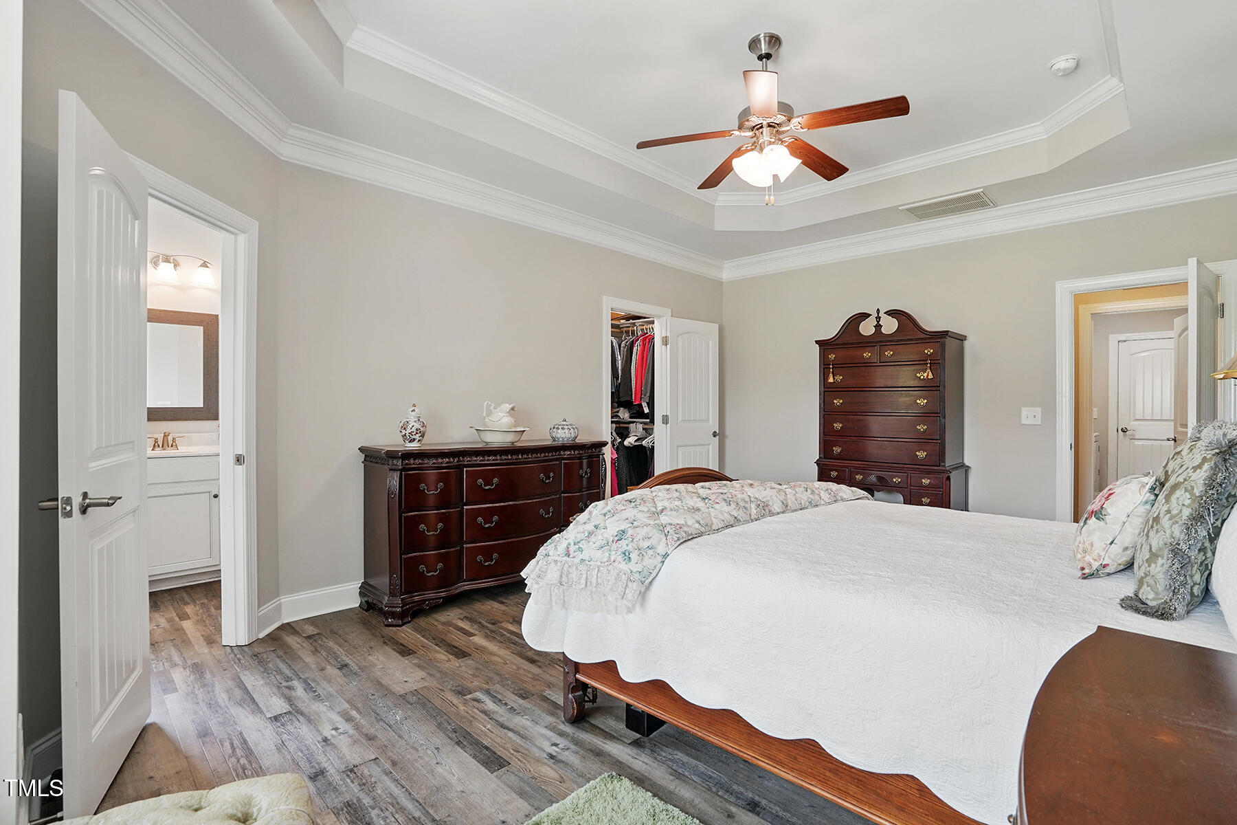 116 Colonade Court Benson, NC 27504 - Photo 18 of 37 a bed room with a bed and a chandelier